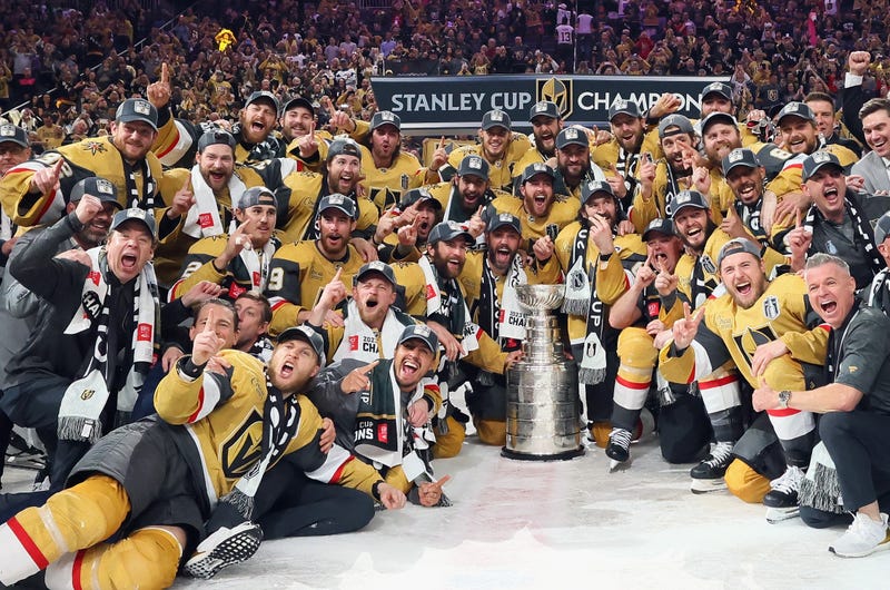 Members of the Vegas Golden Knights pose with the Stanley Cup after defeating the Florida Panthers to win the championship in Game Five of the 2023 NHL Stanley Cup Final at T-Mobile Arena on June 13, 2023
