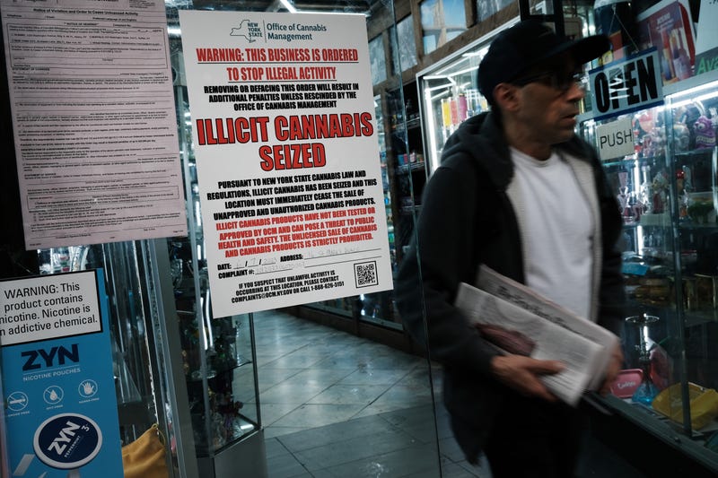 A state of New York notice posted at a business announces the seizure of 'illicit cannabis' at the business as authorities crack down on unlicensed smoke shops on June 16, 2023 in New York City.