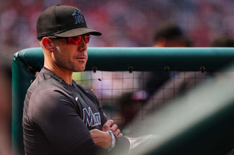 Manager Skip Schumaker #55 of the Miami Marlins looks on from the dugout during the first inning of the game against the Washington Nationals at Nationals Par
