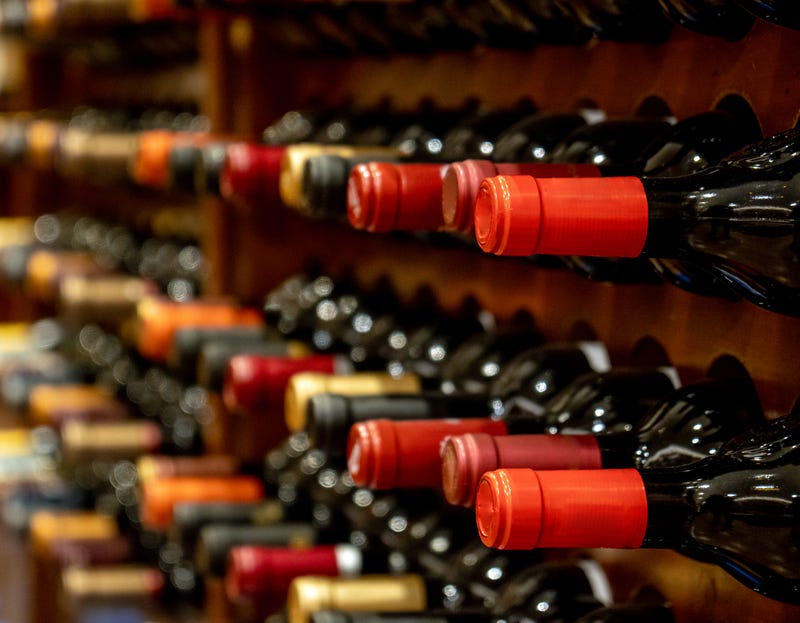 Stock photo of wine bottles on store shelves