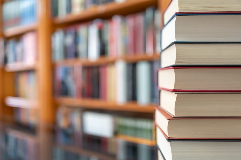 Stack of books, bookshelves