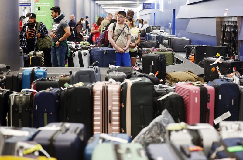 rows of baggage at baggage claim