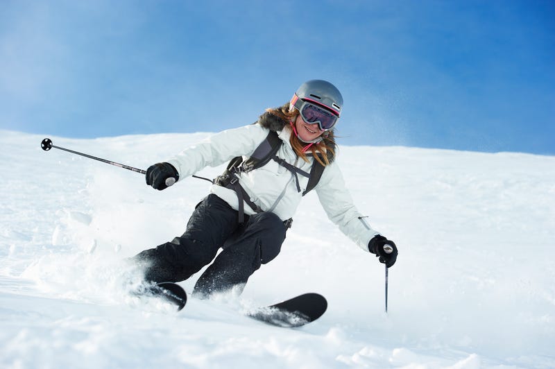 Skier going down a snowy slope