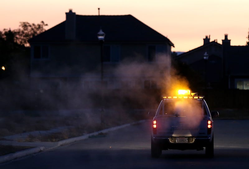 BRENTWOOD, CA - AUGUST 23: Technicians with the Contra Costa County Mosquito and Vector Control District drive a truck through a neighborhood fogging with Pyrocide 7396 insecticide on August 23, 2012 in Brentwood, California. In the wake of the largest outbreak of the West Nile Virus in the U.S. history, the Contra Costa County Mosquito and Vector Control is fogging areas of the county that have seen a spike in numbers of mosquitoes carrying the West Nile Virus. More than 1,100 people in the Unites States have been infected with West Nile and 41 people have died. (Photo by Justin Sullivan/Getty Images)