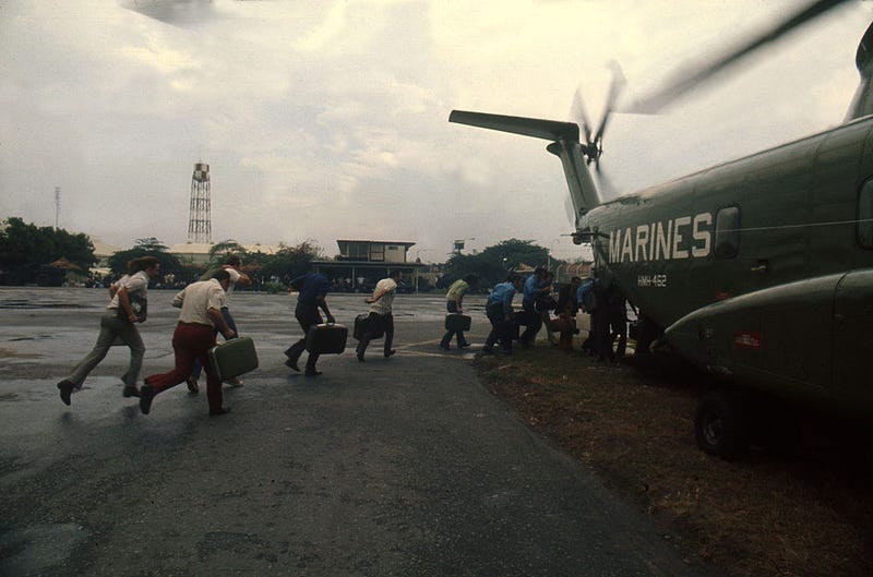As Saigon falls to the communist rule of North Vietnamese, US Marines evacuate Americans and Vietnamese April, 1975 at Tan Son Nhut Airbase, in South Vietnam