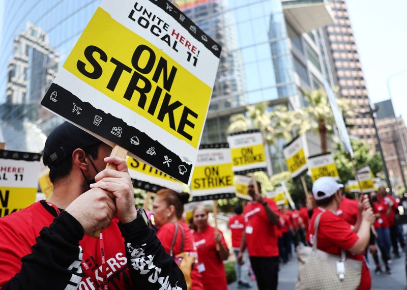 Hotel workers with Unite Here Local 11 picket outside the InterContinental hotel on the first day of a strike by union members at many major hotels in Southern California on July 2, 2023 in Los Angeles, California.