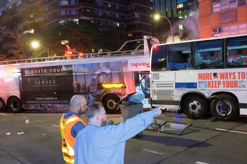 Emergency workers respond after a double-decker tour bus collided with an MTA bus at East 23rd Street and First Avenue in Manhattan on Thursday, July 6, 2023