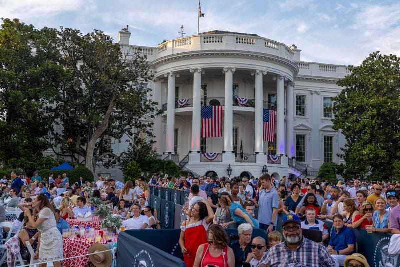 Guests on the South Lawn get a chance to see President Joe Biden and first lady Jill Biden arrive on the South Lawn on July 04, 2023 in Washington, DC.