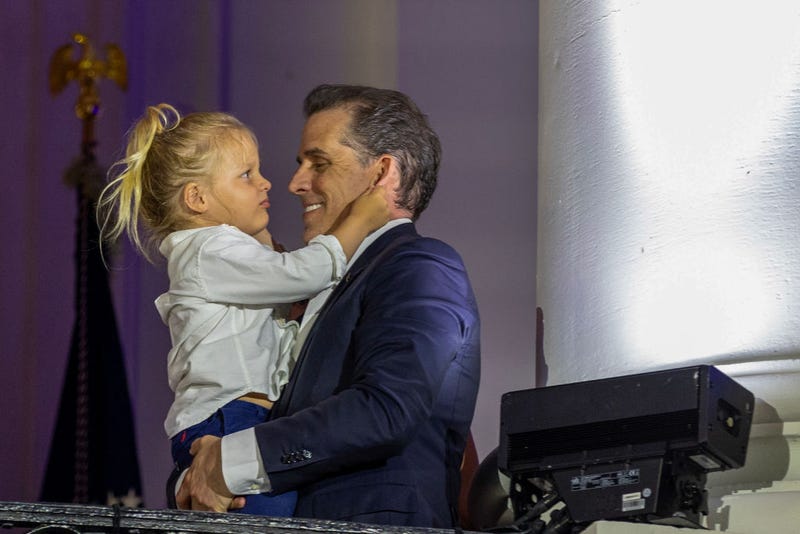 Hunter Binden holding Beau Biden watches fireworks on the South Lawn of the White House on July 04, 2023 in Washington, DC. The Bidens hosted a Fourth of July BBQ and concert with military families and other guests on the South Lawn of the White House. (Photo by Tasos Katopodis/Getty Images)