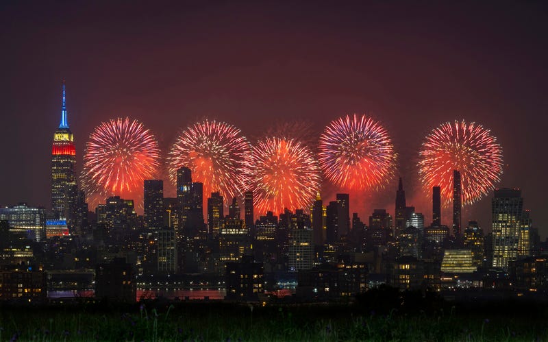 Macy's 4th of July fireworks light up the sky next to the Empire State Building on July 4, 2023