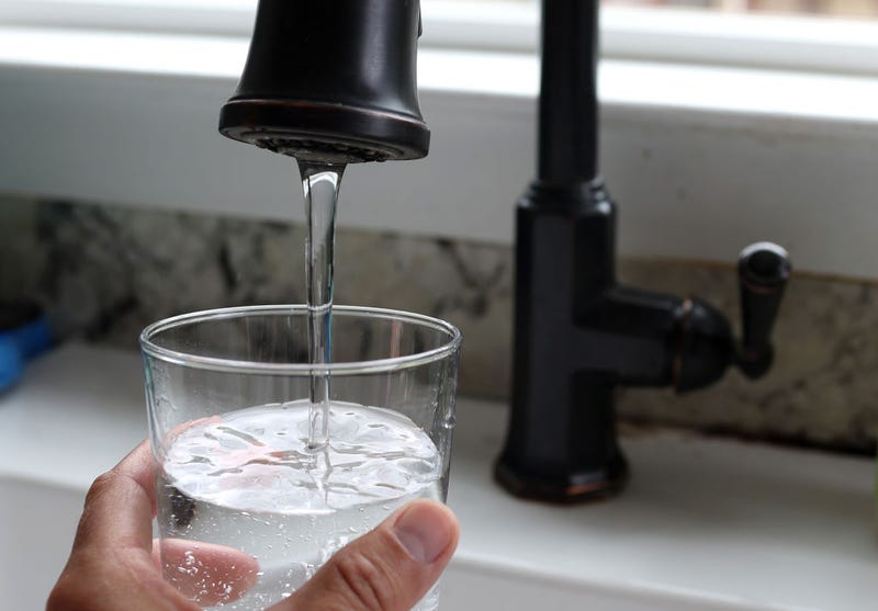 In this photo illustration, water from a tap fills a glass on July 06, 2023 in San Anselmo, California. According to a study by the US Geological Survey, nearly half of the tap water in the United States is contaminated with "forever chemicals" that are considered dangerous to human health. Per and polyfluorinated alkyl substances, or PFAS, are chemicals that linger in the body and are linked to health issues like cancer, obesity, liver damage, decreased fertility, thyroid disease, high cholesterol and hormone suppression. (Photo Illustration by Justin Sullivan/Getty Images)