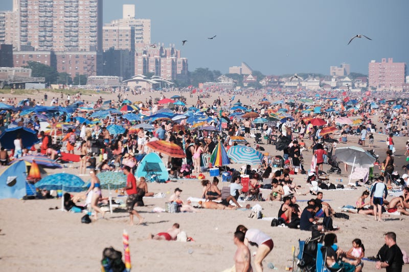 People cool off at the beach in Coney Island on July 6, 2023