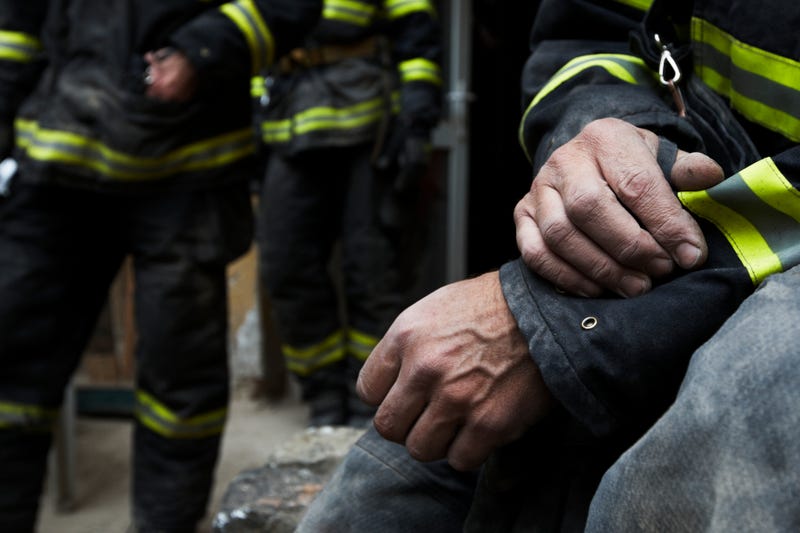 A fire fighter working flames on a burning house in northwest Detroit issued a mayday call early Wednesday morning after the floor he was standing collapsed beneath him.