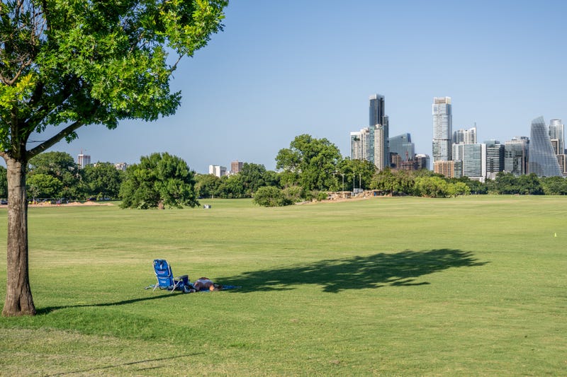 A person rests in the shade at Zilker Metropolitan Park on July 10, 2023, in Austin, Texas. Record-breaking temperatures continue soaring as prolonged heatwaves sweep across the Southwest.