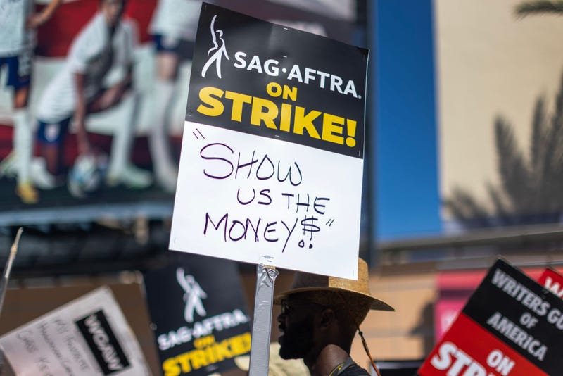 Members of the Hollywood actors SAG-AFTRA union walk a picket line with screenwriters outside of FOX Studios on Day 2 of the actors' strike on July 14, 2023 in Los Angeles, California.