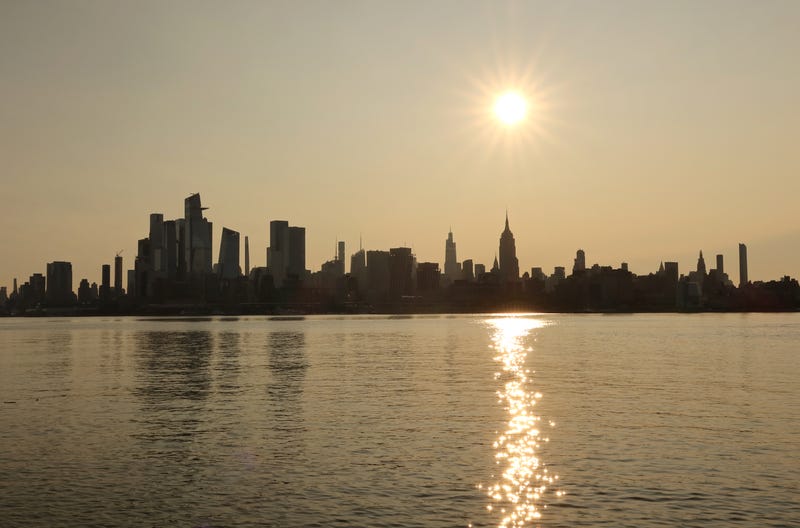 The sun rises over Manhattan on July 11, 2023