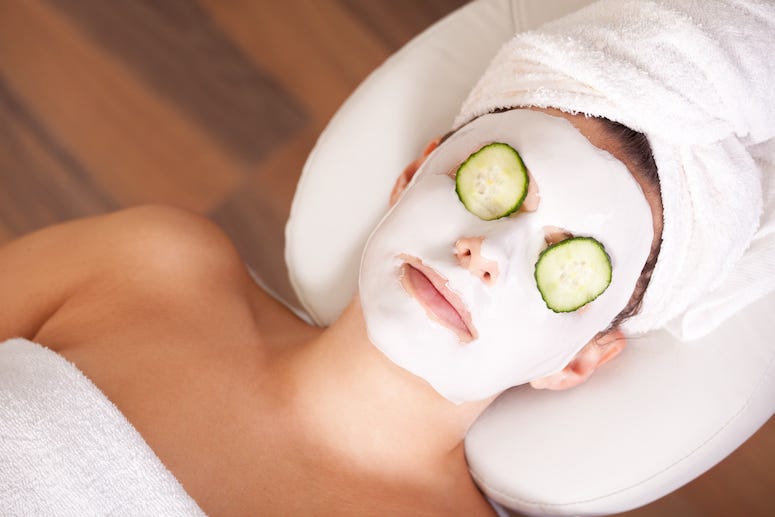 Woman wearing facial mask in spa
