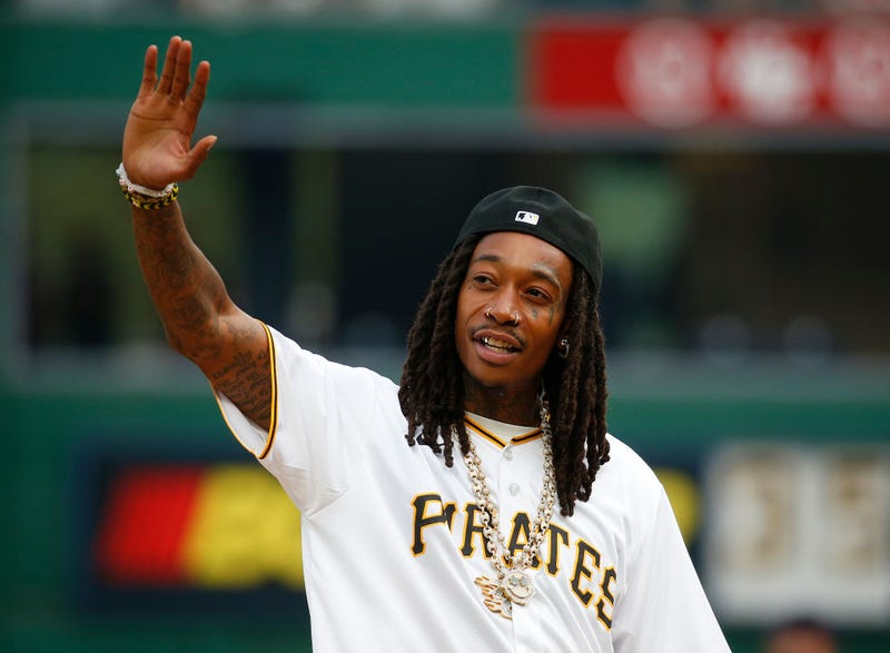 Wiz Khalifa waves to the crowd