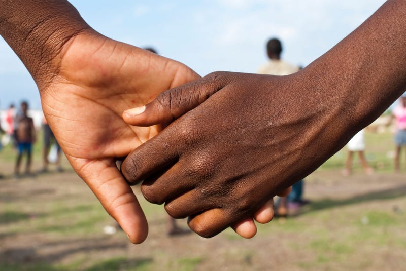 Children holding hands in Leogane, Hait
