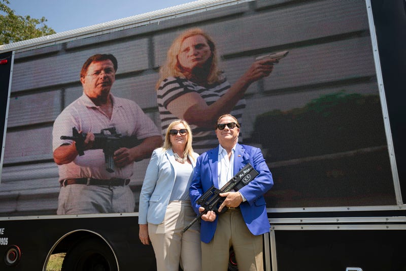 Mark and Patricia McCloskey of St. Louis, Missouri pose for a photo before speaking at a "Defend Our 2A: Michigan's Fight for Self Preservation" rally at a farm on July 19, 2023 in Ionia, Michigan. 