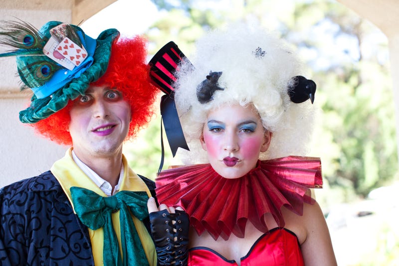 Man dressed as Mad Hatter and woman as Queen of Hearts from Alice in Wonderland