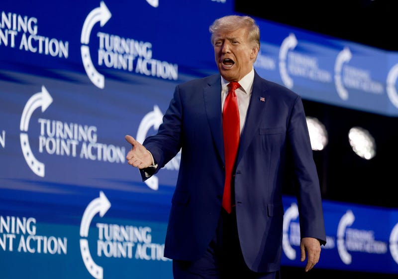 Former US President Donald Trump arrives on stage to speak at the Turning Point Action conference as he continues his 2024 presidential campaign on July 15, 2023 in West Palm Beach, Florida. 