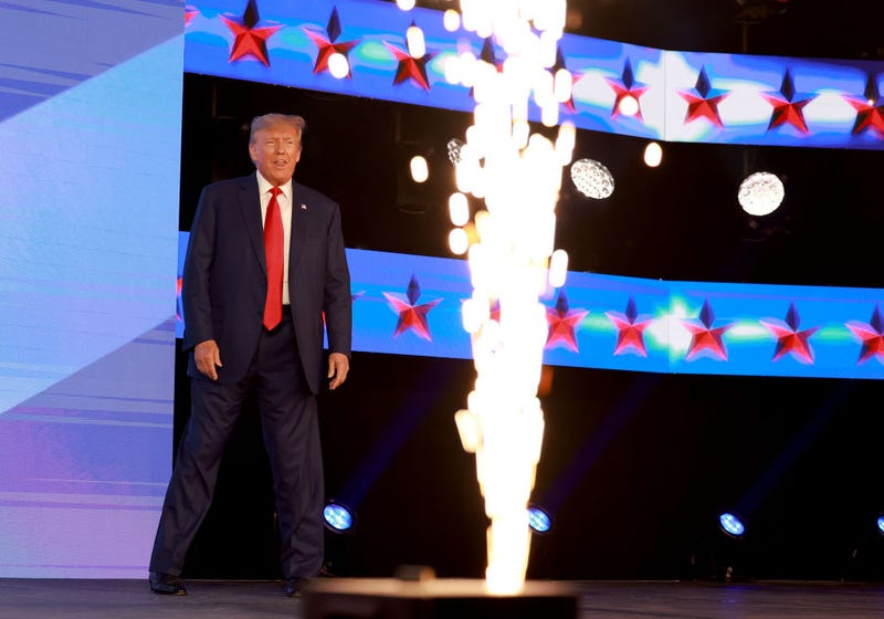 Former US President Donald Trump arrives on stage to speak at the Turning Point Action conference as he continues his 2024 presidential campaign on July 15, 2023 in West Palm Beach, Florida. 