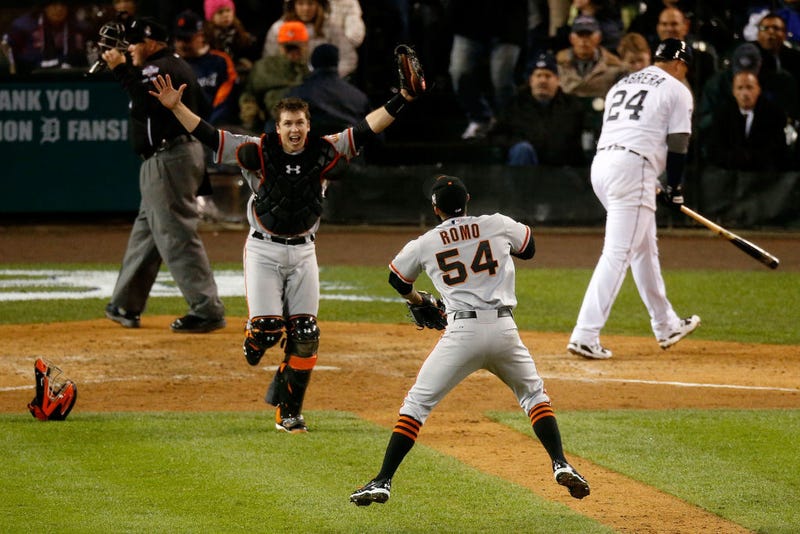 Sergio Romo #54 of the San Francisco Giants celebrates with Buster Posey #28 after striking out Miguel Cabrera #24 of the Detroit Tigers in the tenth inning to win Game Four of the Major League Baseball World Series at Comerica Park on October 28, 2012 in Detroit, Michigan.