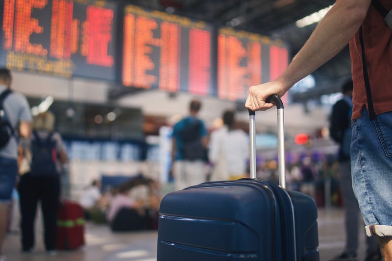 person at the airport waiting for flight