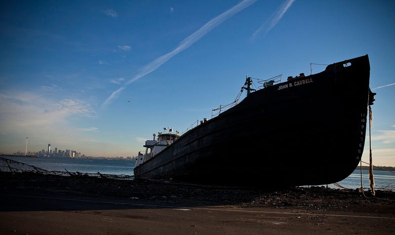 The John B. Caddell tanker sits on the shore of Staten Island on Nov. 1, 2012, after running aground during Sandy. The Manhattan skyline is visible in the distance