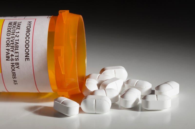 A 48-year-old Dearborn doctor will spend four years in federal prison after he pleaded guilty to illegally distributing thousands of perception pills without medical reason, authorities said on Wednesday.