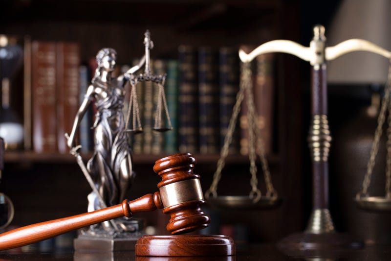 gavel, scale and Themis sculpture