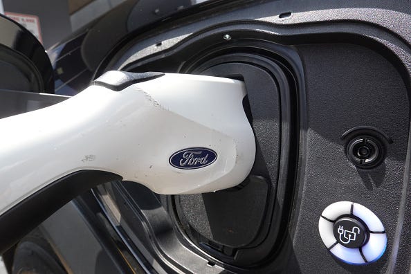 An electric vehicle is charged at the Golf Mill Ford dealership on July 18, 2023 in Niles, Illinois.
