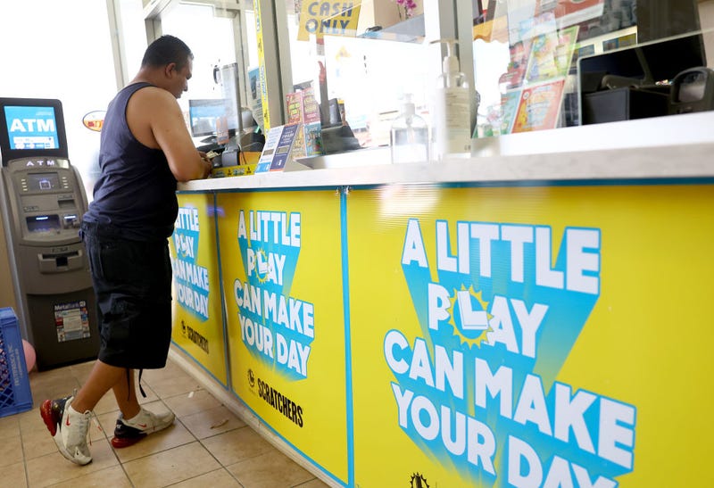  A customer stands in the Las Palmitas Mini Market on July 20, 2023 in Los Angeles California. The $1.08 billion winning Powerball ticket was sold at the Las Palmitas Mini Market for the July 19th drawing. The jackpot is the third largest in Powerball history and was picked after three months of drawings without a winner. The mini market is located in the downtown Fashion District close to Skid Row. (Photo by Mario Tama/Getty Images)