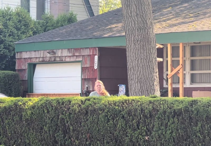 Asa Ellerup, 59, the estranged wife of Gilgo Beach serial killer suspect Rex Heuermann, stands outside the family's home on First Avenue in Massapequa Park, New York, on July 28, 2023