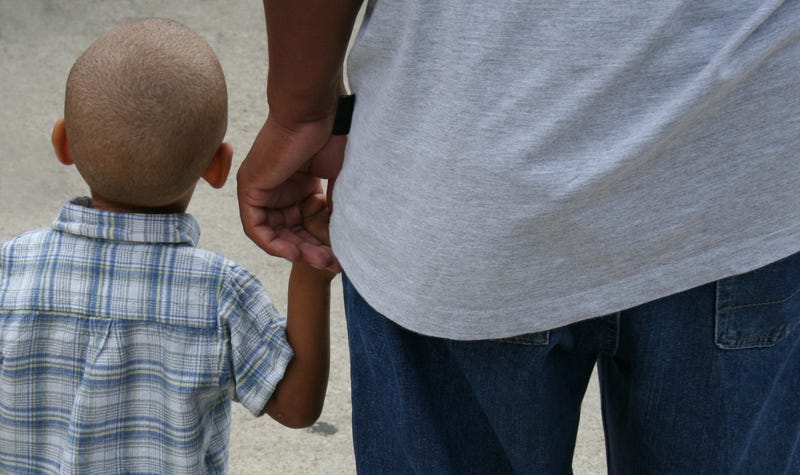 Little Boy Holding Dad's hand