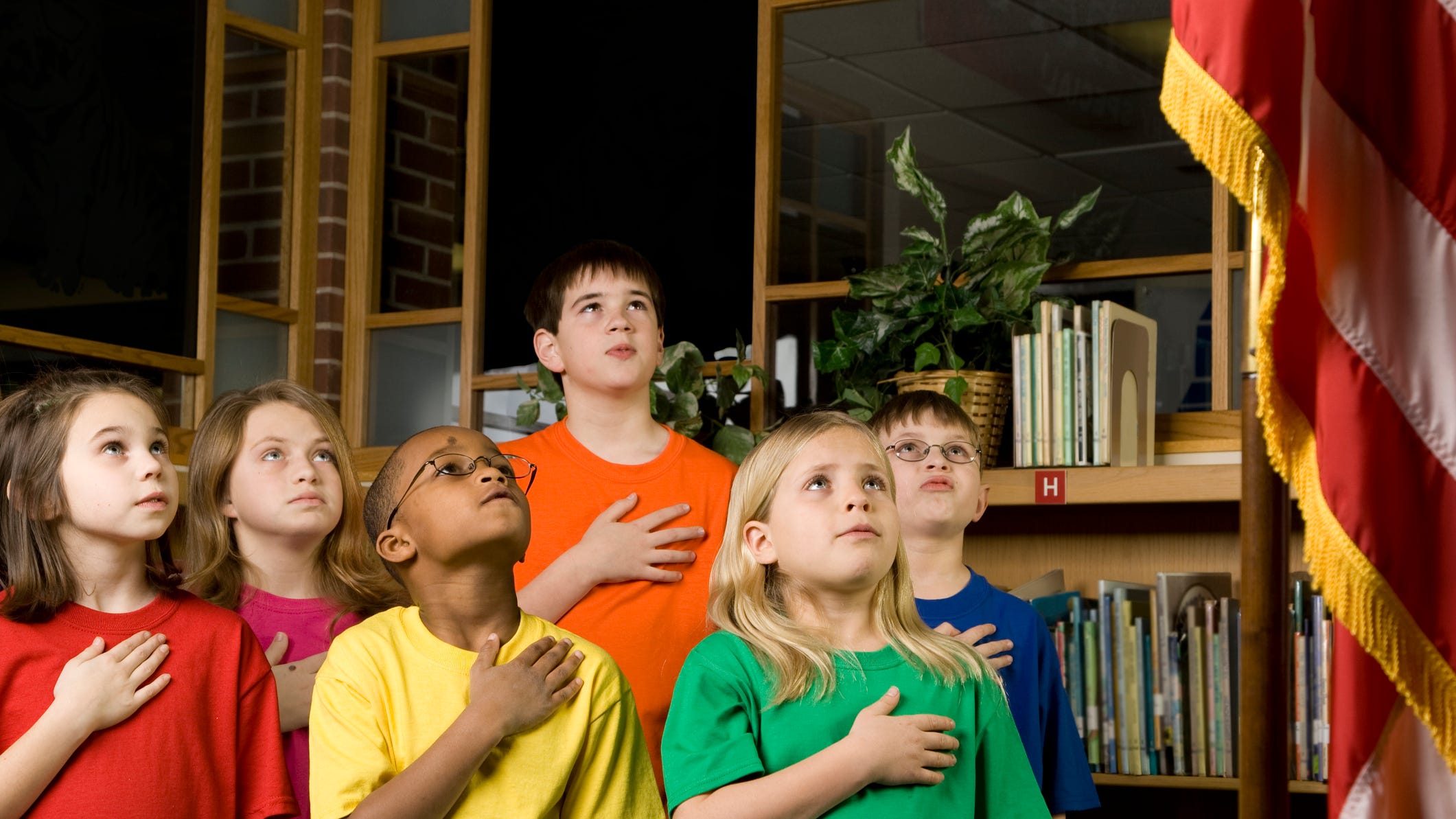 Texas student punished for failing to stand for pledge of allegiance awarded $90,000