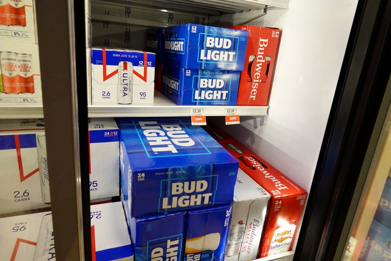Bud Light, made by Anheuser-Busch, sits on a store shelf on July 27, 2023 in Miami, Florida. Anheuser-Busch InBev announced it will lay off hundreds of corporate employees as its Bud Light beer sales continue to struggle. (Photo by Joe Raedle/Getty Images)