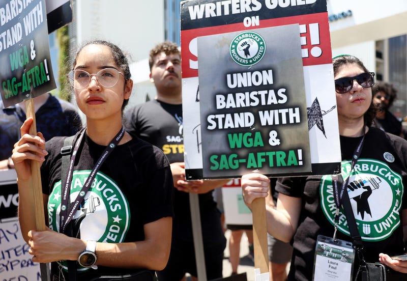 starbucks workers with picket signs