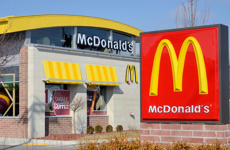 A  McDonalds restaurant and large logo