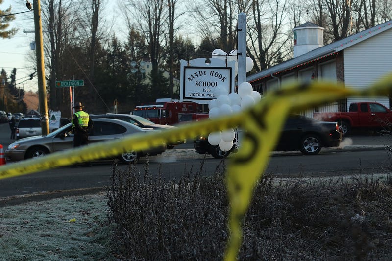 Police tape is viewed outside of the entrance to the Sandy Hook Elementary School on December 15, 2012 in Newtown, Connecticut.