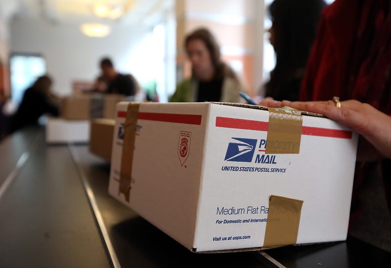 Customers wait in line at a post office in Rincon Center in San Francisco.