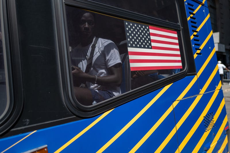Migrants on buses