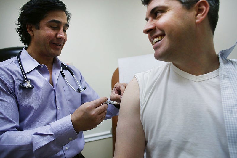 Aaron Lemma recieves a flu shot by Dr. Sassan Naderi at the Premier Care walk-in health clinic which administers flu shots on January 10, 2013 in New York City.