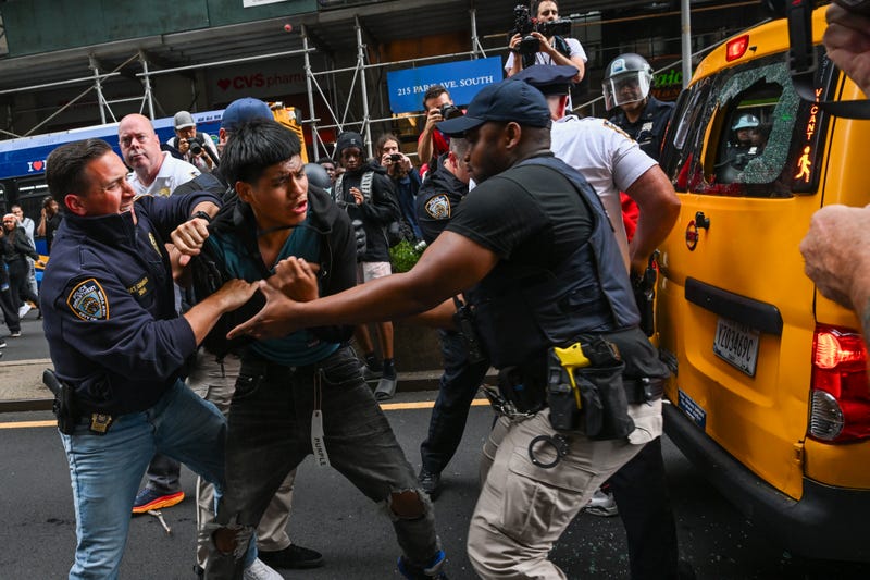 Police grapple with someone near Union Square Park on Aug. 4, 2023