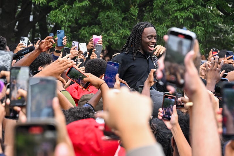 Fans gather around and cheer for Kai Cenat (C) in Union Square on Aug. 4, 2023