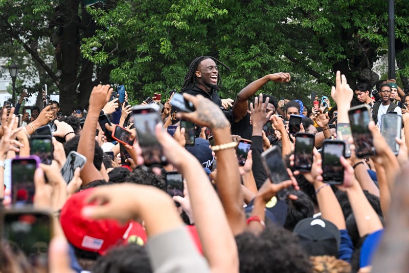 People gather around Kai Cenat (C) at the infamous "giveaway" event in Union Square on Aug. 4, 2023