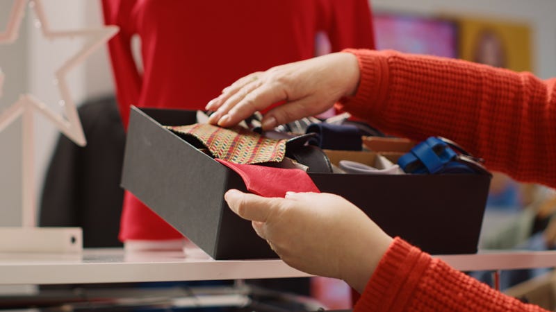 Customer browsing through box at a store