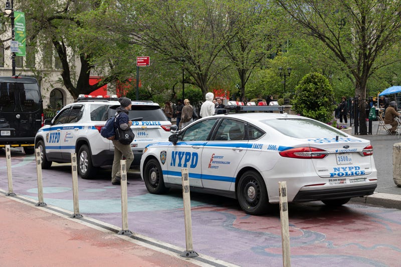 The man was found lying in the grass, unresponsive, inside the park, police said