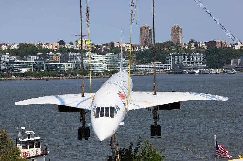 The Concorde being lifted over the Hudson River.
